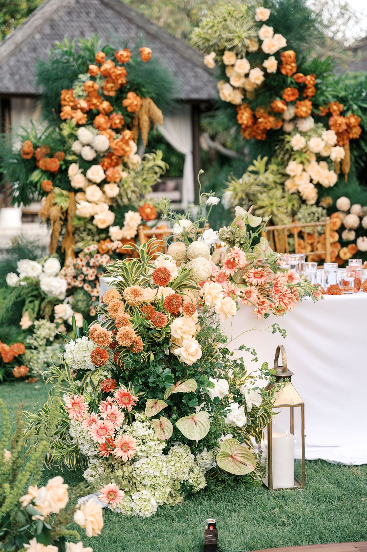 Layered floral and table styling for a Bali wedding